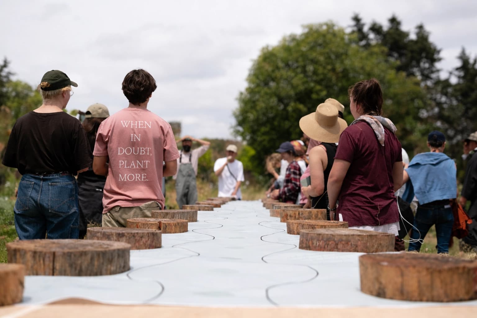 People walking in nature with straw hats